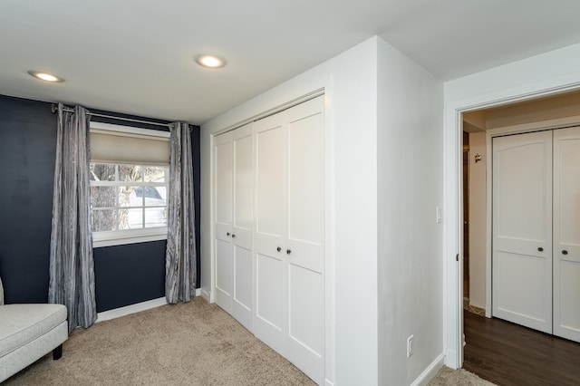 interior space featuring recessed lighting, baseboards, and carpet floors