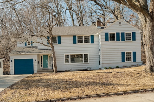 traditional-style home with a shingled roof, concrete driveway, a garage, and a chimney