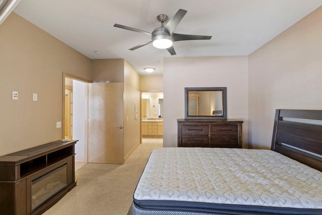 bedroom with light carpet and ensuite bath