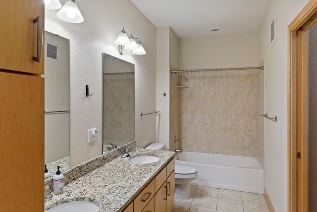 full bath with a sink, visible vents, toilet, and tile patterned floors