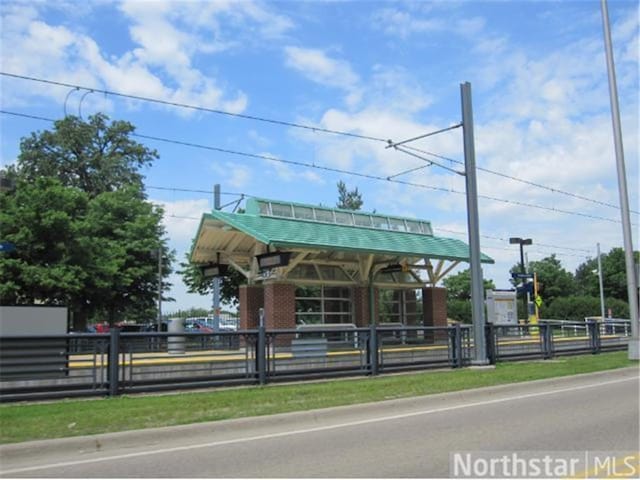 view of property's community featuring fence