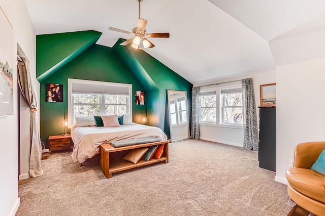 bedroom featuring baseboards, carpet floors, lofted ceiling, and a ceiling fan