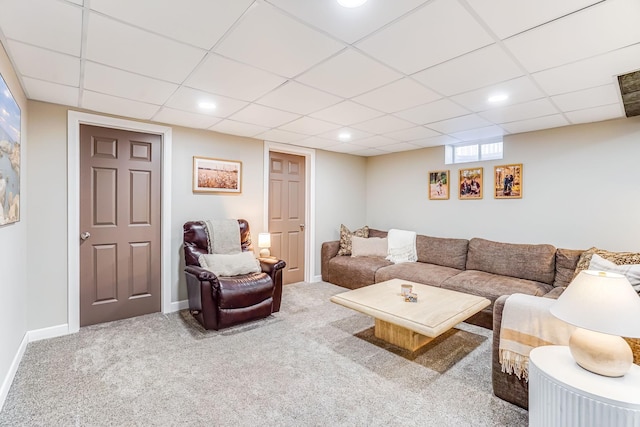 carpeted living area featuring recessed lighting, baseboards, and a paneled ceiling