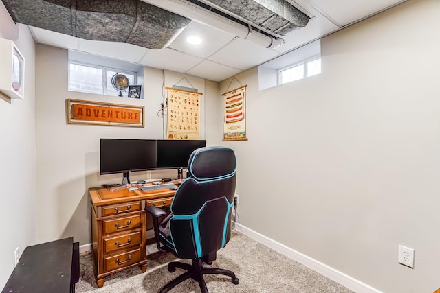 office area with a drop ceiling, baseboards, and carpet floors