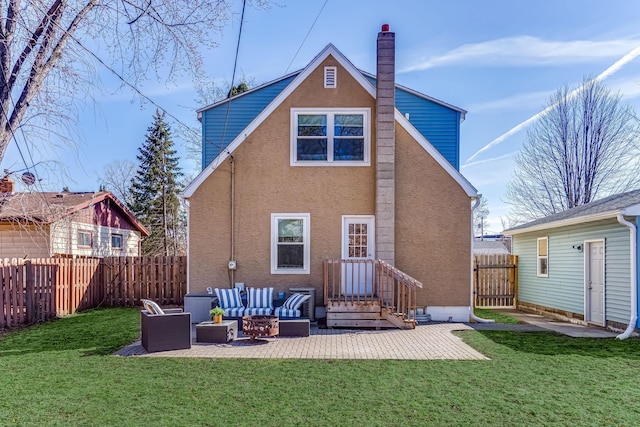 back of house with a patio, fence, an outdoor living space, a yard, and a chimney