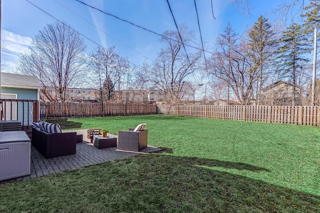 view of yard with a fenced backyard, an outdoor living space, and a patio