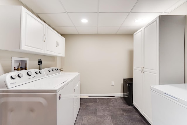 clothes washing area featuring baseboards, separate washer and dryer, recessed lighting, cabinet space, and stone finish floor