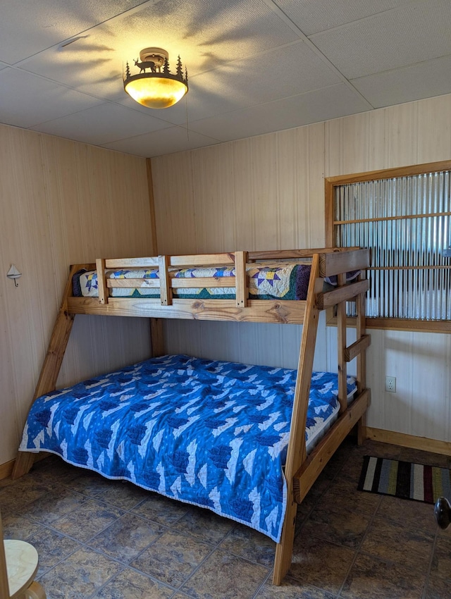 bedroom with wooden walls