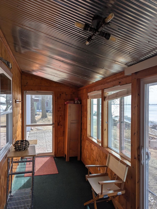 sunroom with vaulted ceiling and wood ceiling