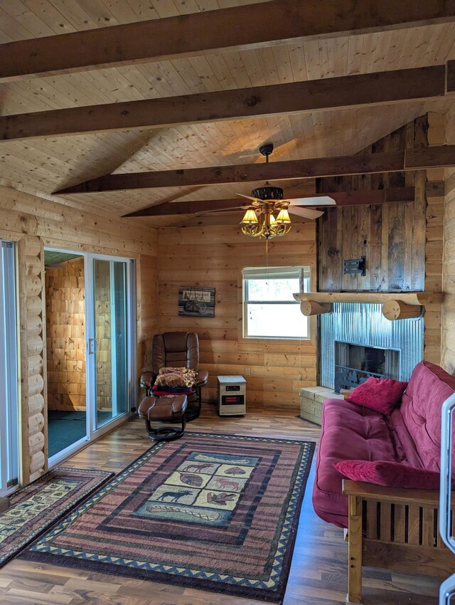 living area featuring rustic walls, vaulted ceiling with beams, wood ceiling, and wood finished floors