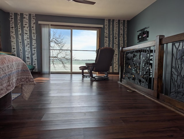 bedroom featuring wallpapered walls, access to outside, wood finished floors, and a ceiling fan