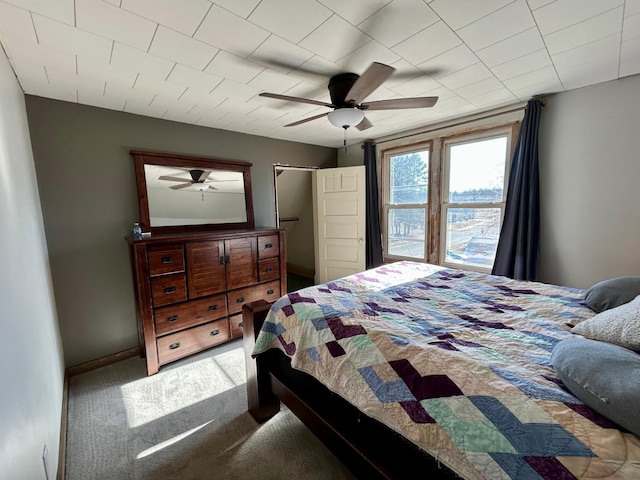 211 Hartley St, Coleraine, MN 55722 - carpeted bedroom featuring a ceiling fan and baseboards