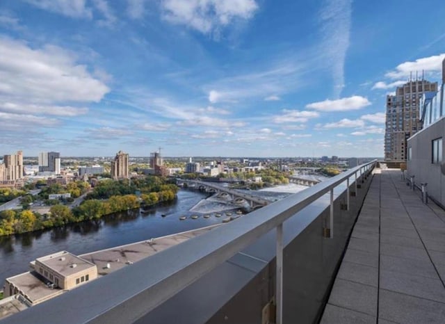 balcony featuring a view of city and a water view