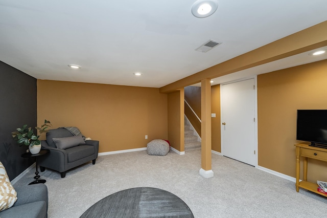 living area featuring visible vents, stairway, carpet, and baseboards