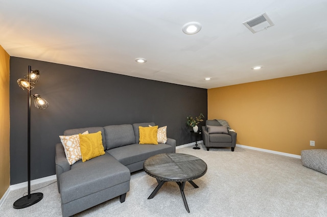 carpeted living room featuring visible vents, recessed lighting, and baseboards