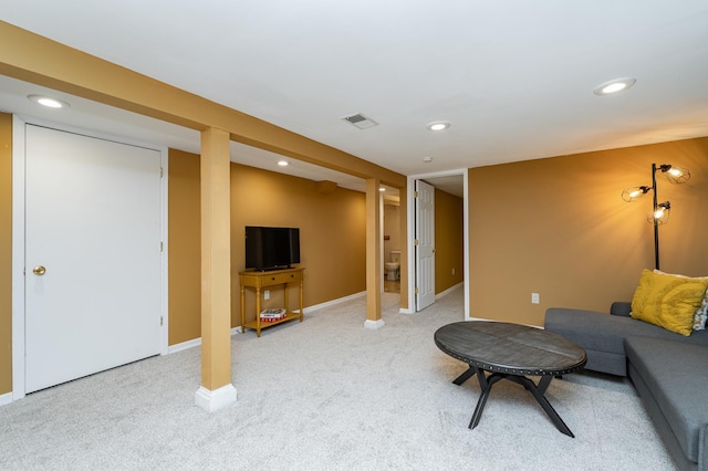 living area with recessed lighting, visible vents, and light colored carpet