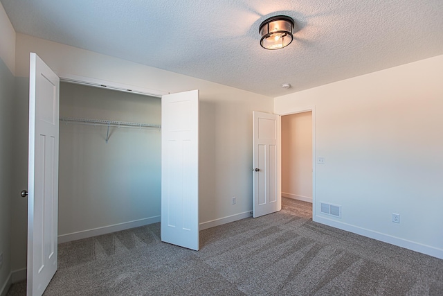 unfurnished bedroom with visible vents, baseboards, and carpet