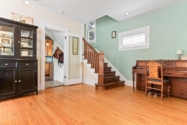 interior space with recessed lighting, light wood-type flooring, and baseboards