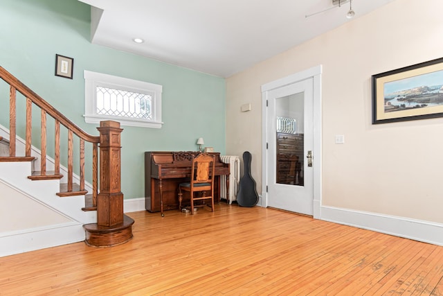 home office featuring baseboards and hardwood / wood-style floors