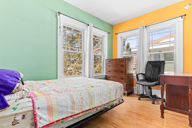 bedroom featuring wood finished floors