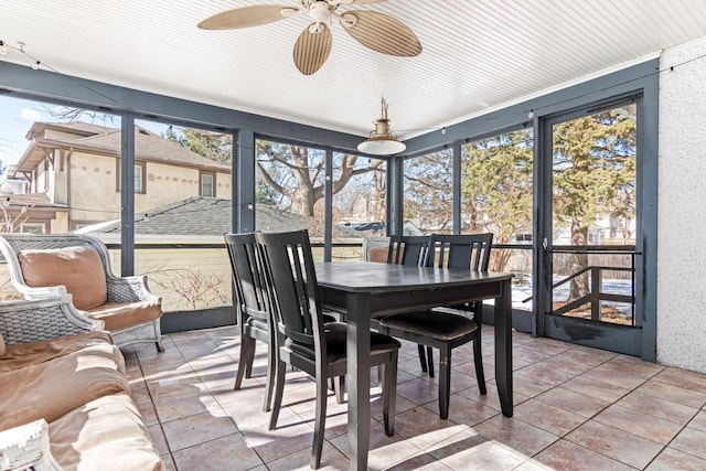 sunroom / solarium with plenty of natural light and a ceiling fan