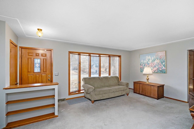 living room with baseboards, visible vents, and carpet floors