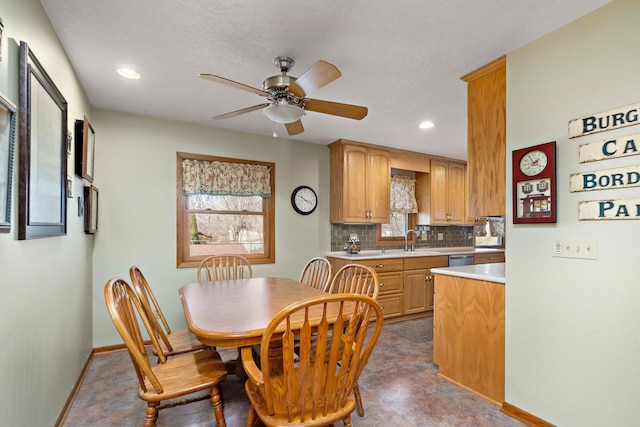 dining area featuring a ceiling fan, recessed lighting, and baseboards