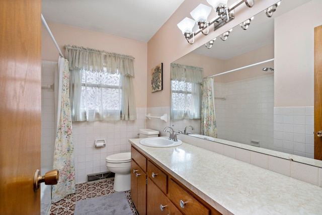 full bathroom featuring a shower with shower curtain, visible vents, tile walls, toilet, and tile patterned floors