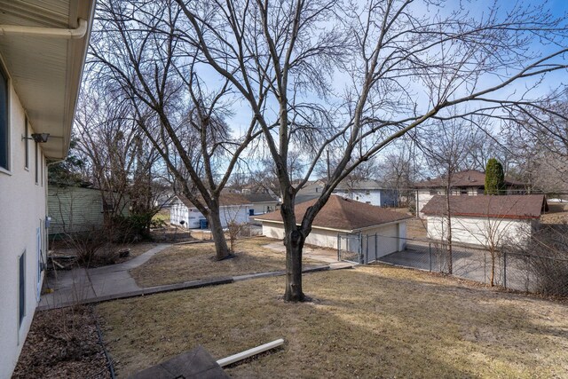 view of yard featuring fence and a residential view