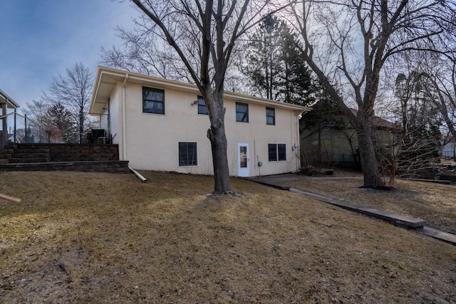 back of property with stucco siding