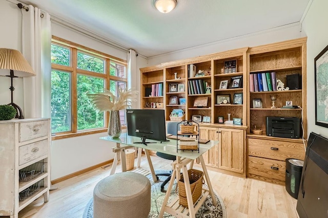 office space featuring light wood-type flooring and baseboards