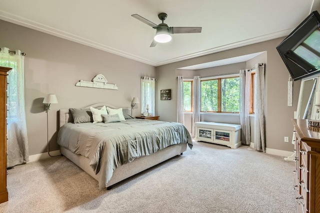 carpeted bedroom with a ceiling fan and baseboards