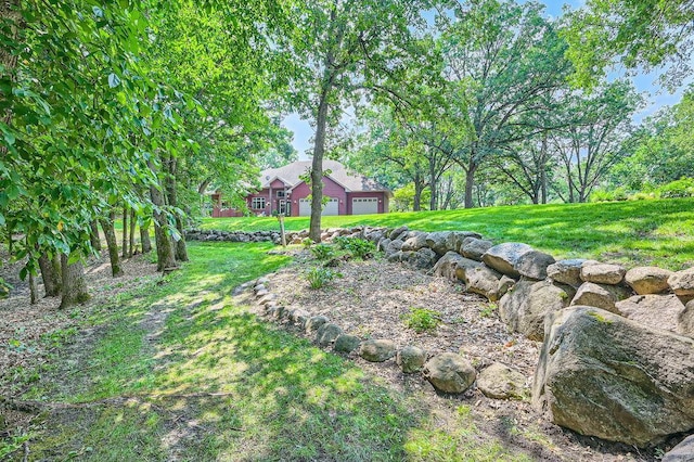 view of yard with an attached garage