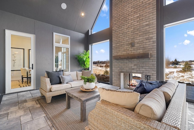 view of patio / terrace with an outdoor living space with a fireplace