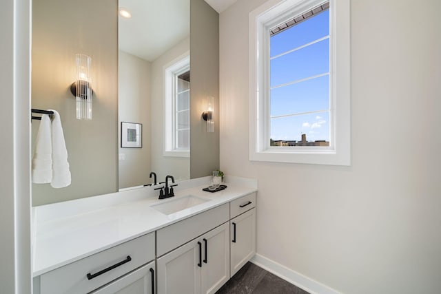 bathroom featuring vanity and baseboards