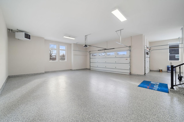 garage featuring baseboards and a garage door opener