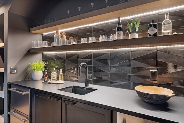 bar with indoor wet bar, a warming drawer, backsplash, and a sink