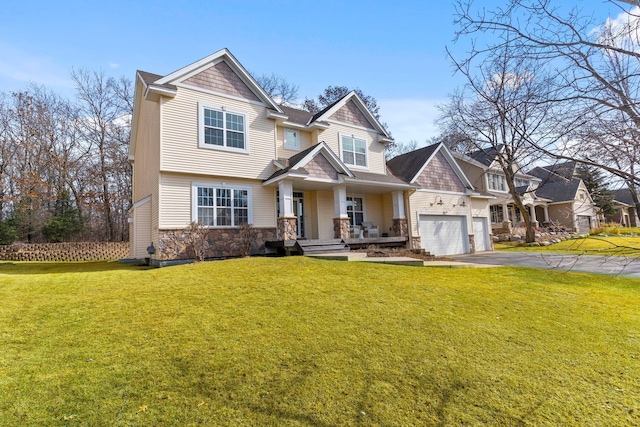 craftsman-style house with aphalt driveway, stone siding, an attached garage, and a front lawn