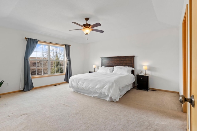 bedroom with visible vents, carpet, baseboards, and ceiling fan