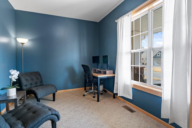 office area with visible vents, baseboards, plenty of natural light, and carpet flooring