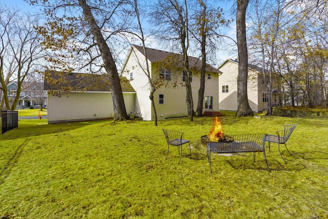 view of yard featuring an outdoor fire pit