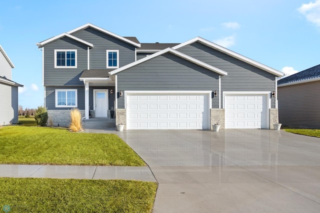 craftsman-style house featuring brick siding, a front lawn, concrete driveway, and a garage