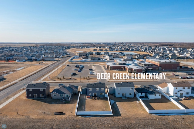 birds eye view of property with a residential view