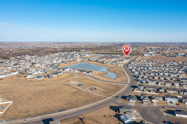 birds eye view of property with a residential view