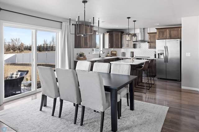 dining space featuring recessed lighting, dark wood-style floors, and baseboards