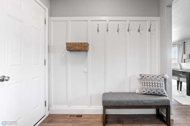 mudroom featuring wood finished floors and visible vents