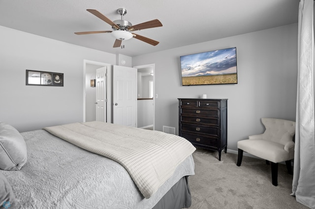 bedroom featuring visible vents, light carpet, baseboards, and ceiling fan