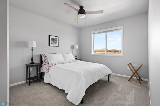 bedroom featuring baseboards, carpet, and ceiling fan