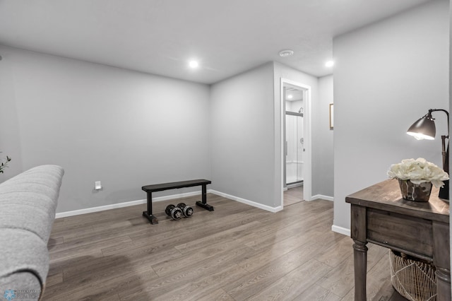 sitting room featuring recessed lighting, wood finished floors, and baseboards