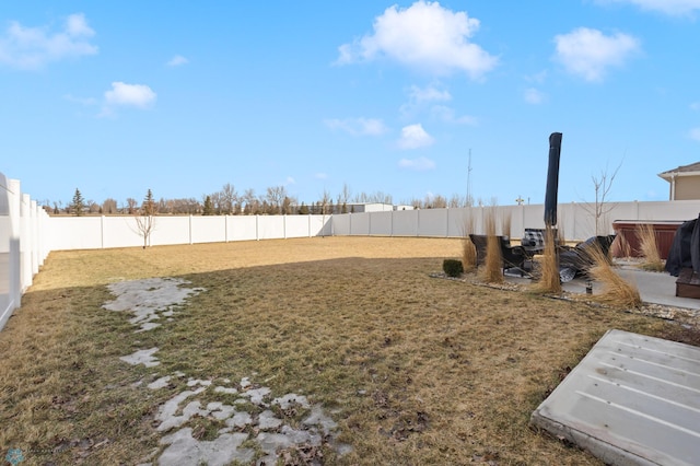 view of yard with a fenced backyard